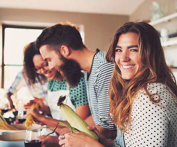 stock image- friends cooking in kitchen
