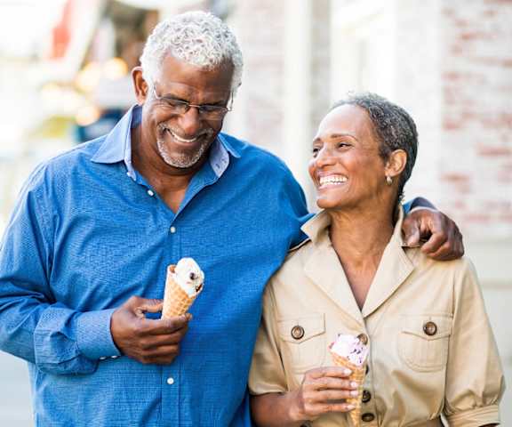 stock image- happy senior couple walking