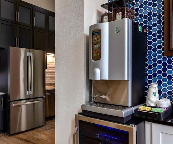 a kitchen with a refrigerator and a microwave