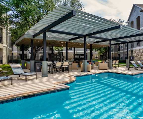 a swimming pool with a large canopy over it