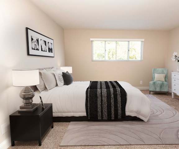 a bedroom with a bed and a dresser at Stevenson Lane Apartments, Towson MD