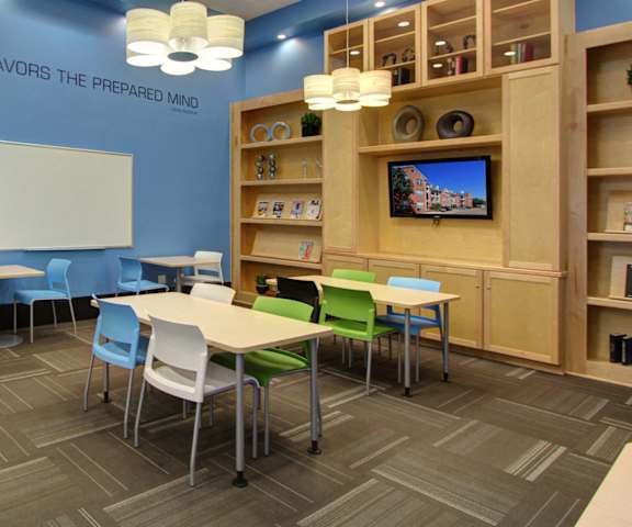img src="business center.png" alt="business center with built-in bookshelves"
