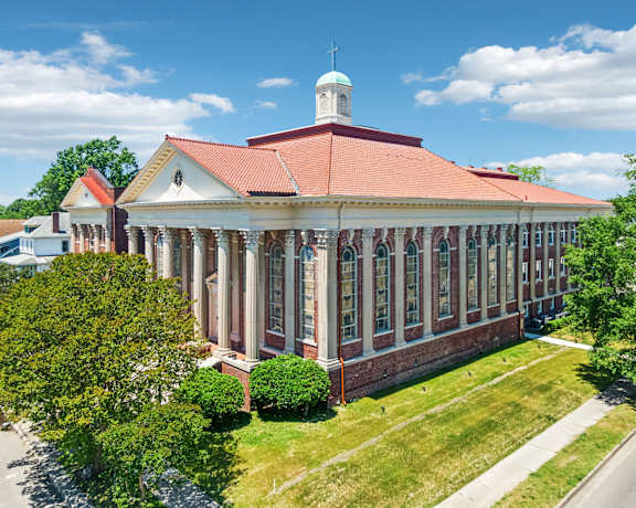 a large building with many windows and a steeple