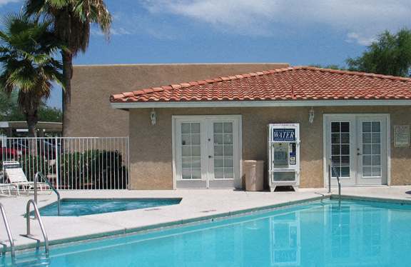 a building with a swimming pool in front of it