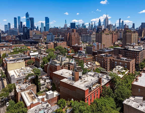 A cityscape with a mix of residential and commercial buildings.