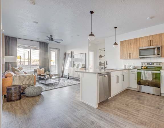 a kitchen and living room in a 555 waverly unit