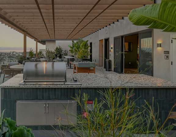 a kitchen with a bar and a view of the city