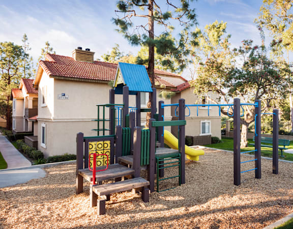 a playground at the whispering winds apartments in pearland, tx
