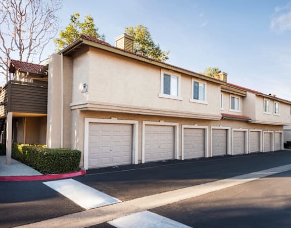a row of townhomes with garages