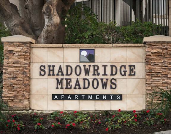 a sign in front of a building