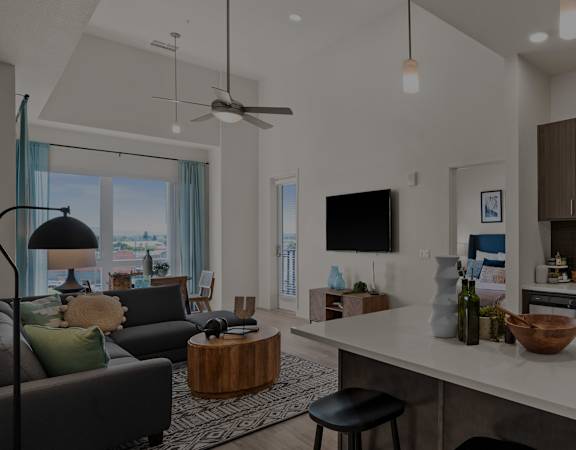 a rendering of a kitchen and living room in a development