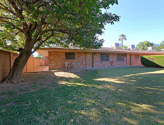 a house with a yard and a tree