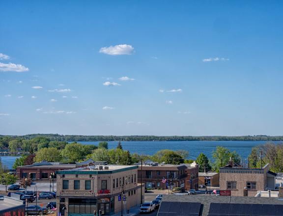 A view of downtown Waconia with a lake in the background.