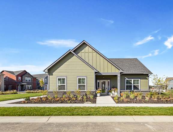 A house with a grey front yard and a grey roof.