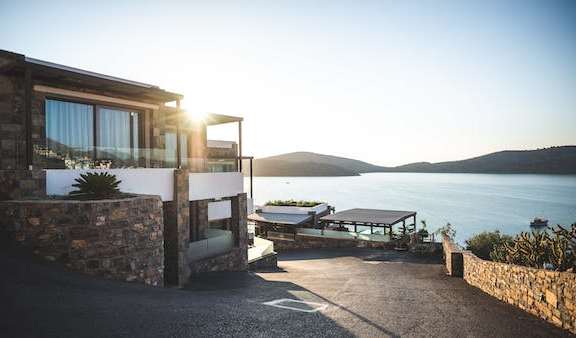 a house that is sitting next to a body of water