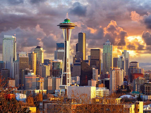 A city skyline with a prominent tower in the center.