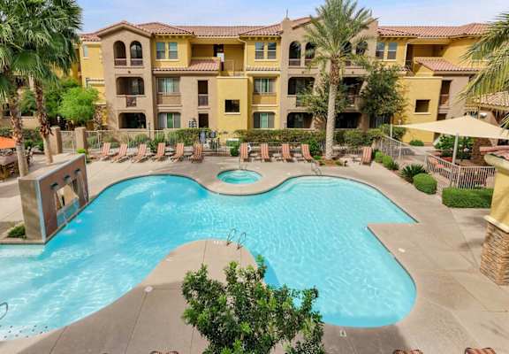 Aerial view of pool and exterior building