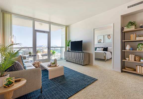 a living room with a couch and a tv  at Vue, California, 90731
