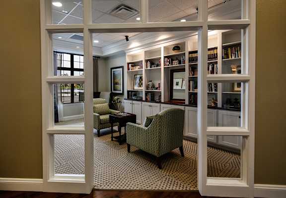 a room with two chairs and a table at Arbor Hills, Florida, 33805