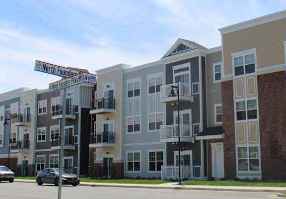 a row of new apartment buildings on a city street