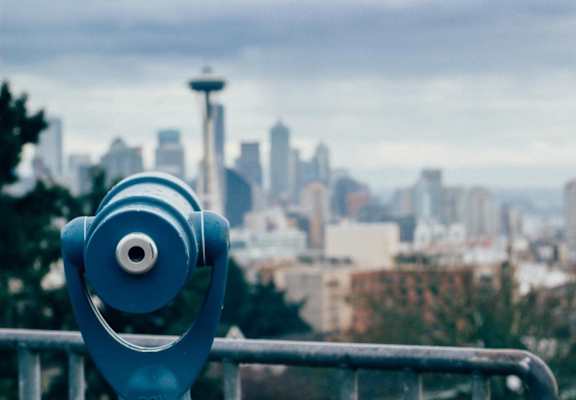 a telescope overlooking the seattle skyline