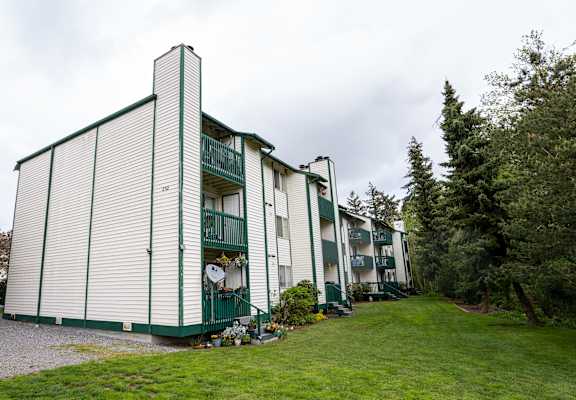 a view of the apartments from the parking lot