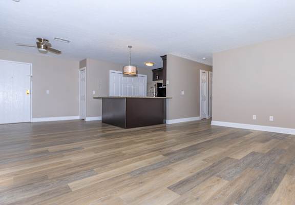 the living room and kitchen in a 555 waverly unit