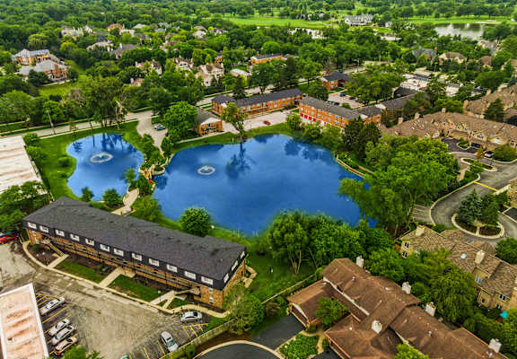 a birdseye view of a large pond in the middle of a city at The Hinsdale, Hinsdale