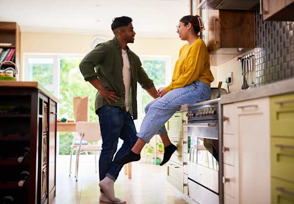 Young couple hanging out in the kitchen at Williamsburg South, Pittsburgh, PA