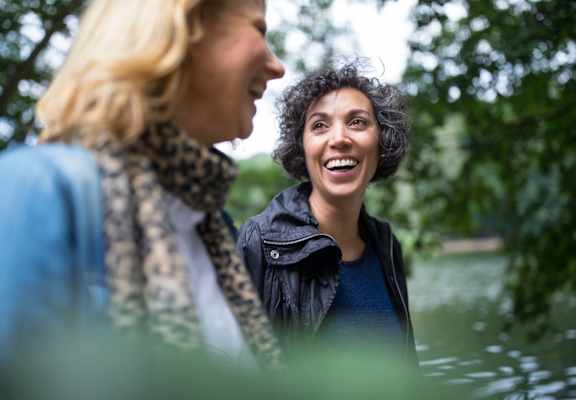 a woman laughing with another woman in a lake at Stonebridge, Ellington, CT