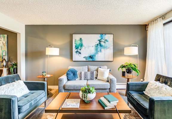 a living room with two couches and a coffee table  at ReNew at Neill Lake, Minnesota, 55344