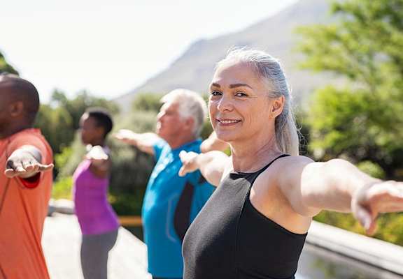 Adults enjoying outdoor yoga  at The Clubhouse at Port Orchard, Washington