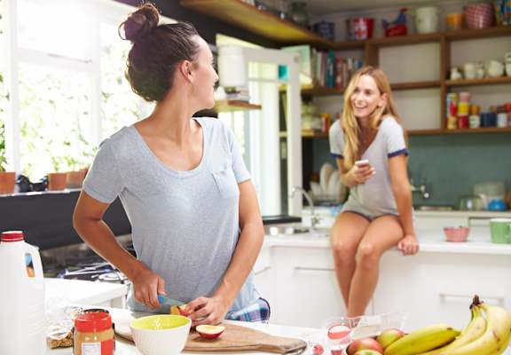 Female Roommates cooking in Kitchen at Maurice Dear Apartments, Oregon