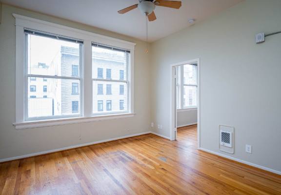 apartment interior with hardwood floors and city views at Maurice Dear Apartments, Portland, OR