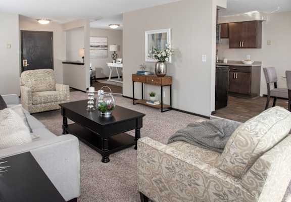one plus den model, view of living room looking at kitchen, living room and den