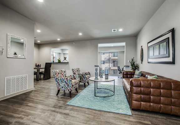 a living room with a leather couch and a table