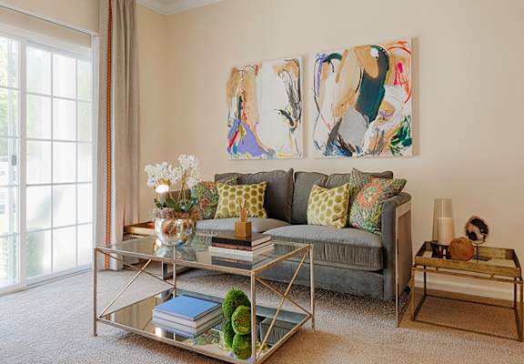 Living room with sofa; door to patio or balcony