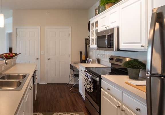 This is a photo of the kitchen in the 2 bedroom, 2 bath Islander floor plan at Nantucket Apartments in Loveland, OH.