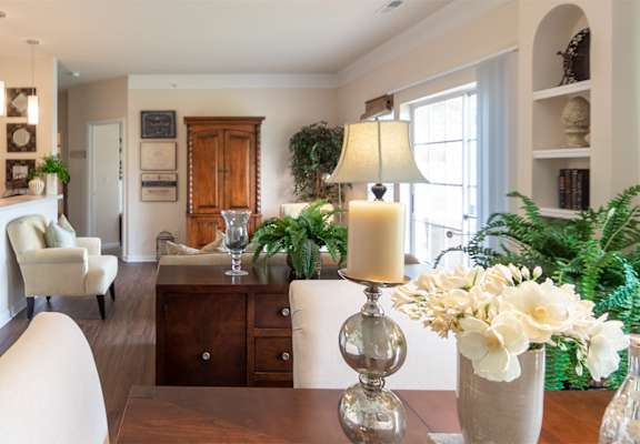 This is a photo of the living room from the dining area in the 2 bedroom, 2 bath Islander floor plan at Nantucket Apartments in Loveland, OH.
