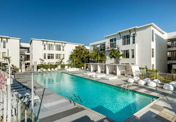 a swimming pool at an apartment building with a pool