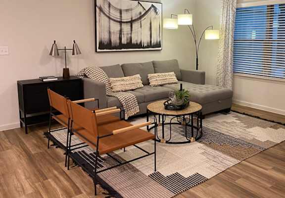 a living room with a couch and a table