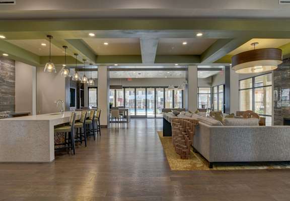 a large living room with couches and chairs at Park at Rialto Apartments, San Antonio, TX 78257arge Balcony at Park at Rialto Apartments, San Antonio