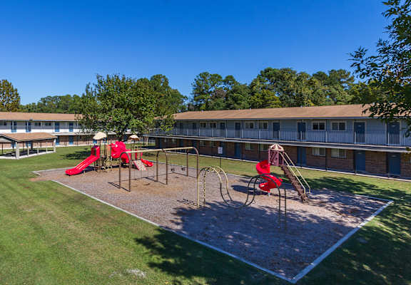 a playground at the whispering winds apartments in pearland, tx