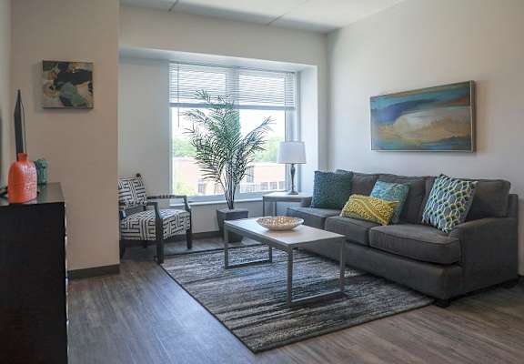 a living room with a couch and a table