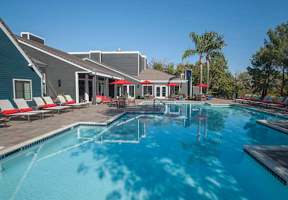 Pool with lounge chairs at KIRKER CREEK, California, 94565