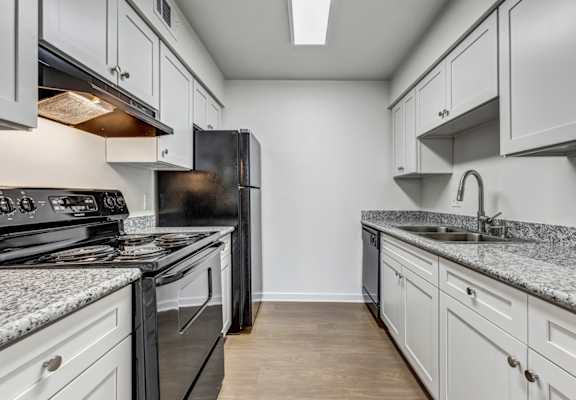 Whitney Manor Apartments in Gretna, LA photo of  kitchen with hardwood floors