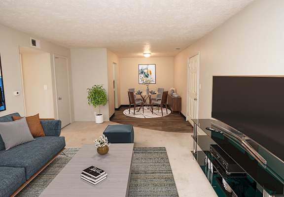 a living room with a couch a table and a tv