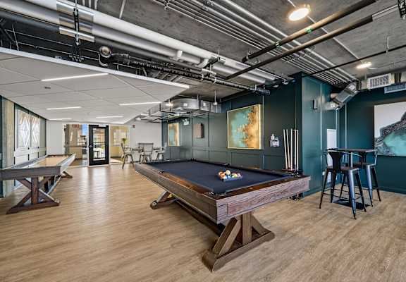 a game room with a pool table and ping pong table at Lakeview 3200 Apartments, Chicago, IL, 60657