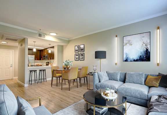 open living room with large windows and connected kitchen