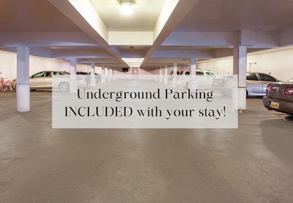 a sign in a parking garage saying underground parking included with your stay